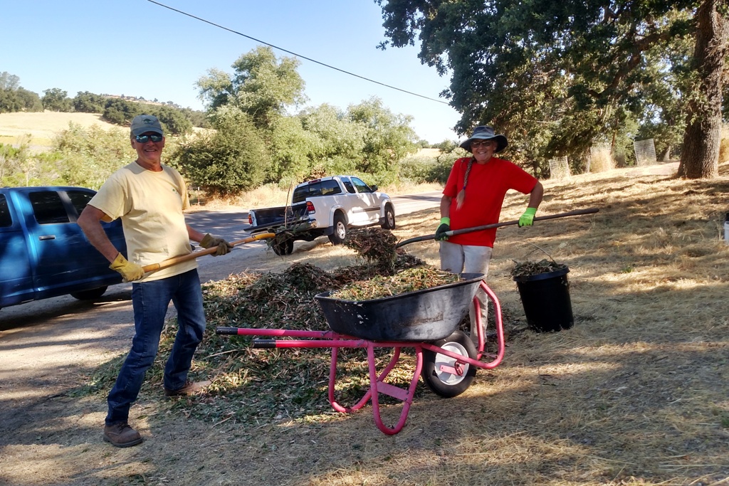 Carl and Judy loading up mulch to put around the trees!